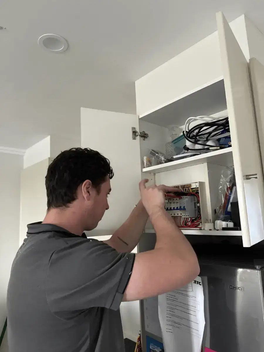 emergency electrician sydney repairing a switch board